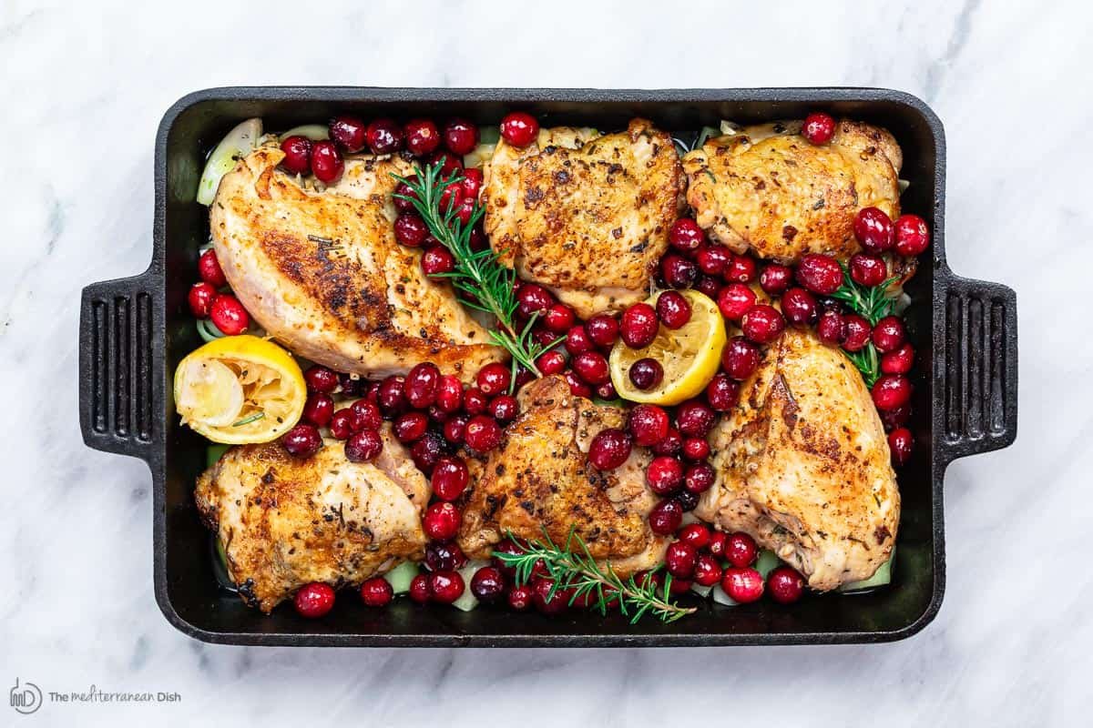 Cranberry chicken in a pan ready for baking