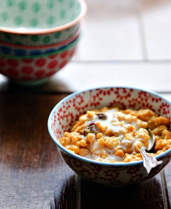 A bowl of chai pumpkin oatmeal with a spoon. 