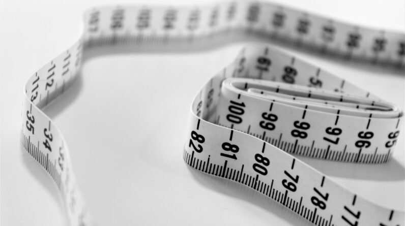 selective focus photography of tape measure